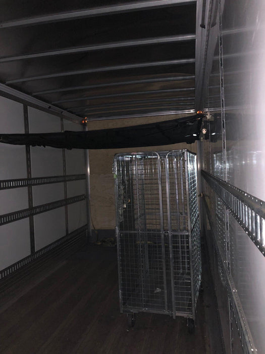 Tray cargo net in transportation vehicle. E-track secured in truck. 