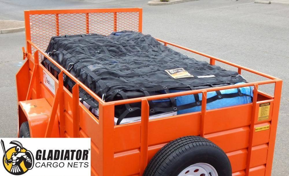 Utility cargo net on medium sized trailer. Securing camping or moving gear
